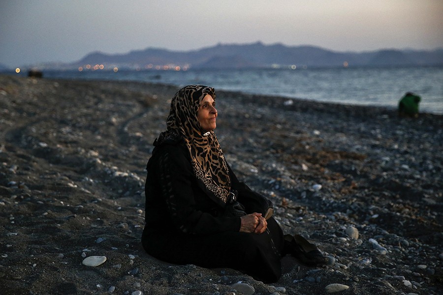 Amoun, 70, a blind Palestinian refugee who lived in the town of Aleppo in Syria, rests on a beach moments after arriving along with another forty on a dinghy in the Greek island of Kos, crossing a part of the Aegean Sea from Turkey to Greece (Yannis Behrakis, Thomson Reuters - August 12, 2015).