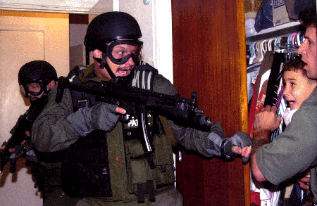 Cuban refugee Elian Gonzalez and Donato Dalrymple, one of the two men who rescued the boy from the sea, in a bedroom closet as federal agents enter the Little Havana home of Elian's relatives. Copyright:  2000, Associated Press