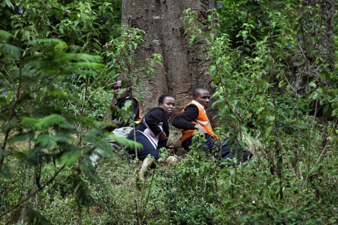 Frightened bystanders took cover in a nearby forest. (Tyler Hicks, The New York Times - September 23, 2013