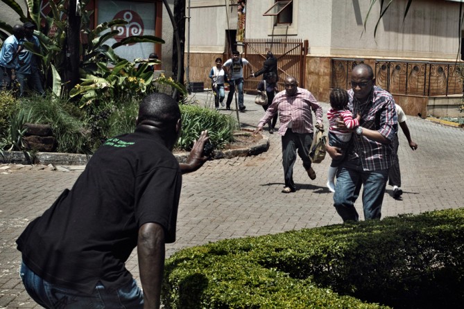 Police and security officers helped civilians escape. The mall had been criticized for lax security. (Tyler Hicks, The New York Times - September 27, 2013
