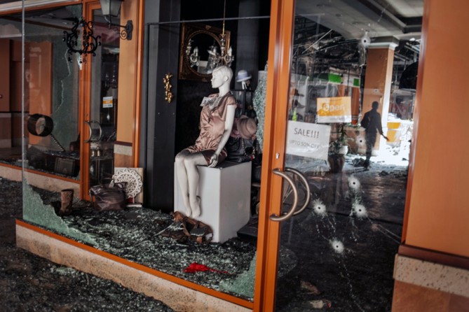 A week after the siege ended, when some shopkeepers were permitted to return, suspicions arose that the Kenyan military had looted the place. Expensive clothing was gone. (Tyler Hicks, The New York Times - September 30, 2013)