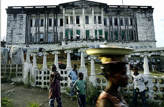 FAR FROM HOME: Thousands of people displaced by fighting came to live in the former Masonic Temple in Monrovia. Founded partly by freed American slaves in the early 19th century, Liberia has long looked upon the U.S. as a kind of godfather. (Carolyn Cole)