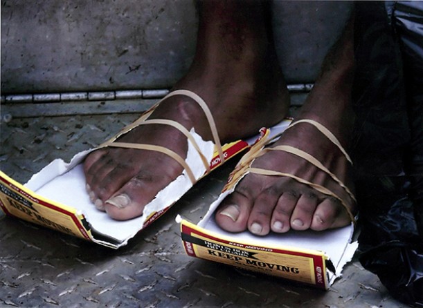 New Orleans, LA -- Jeremiah Ward got by on makeshift shoes after he was rescued in the Ninth Ward. Many storm evacuees had to flee without crucial possessions.