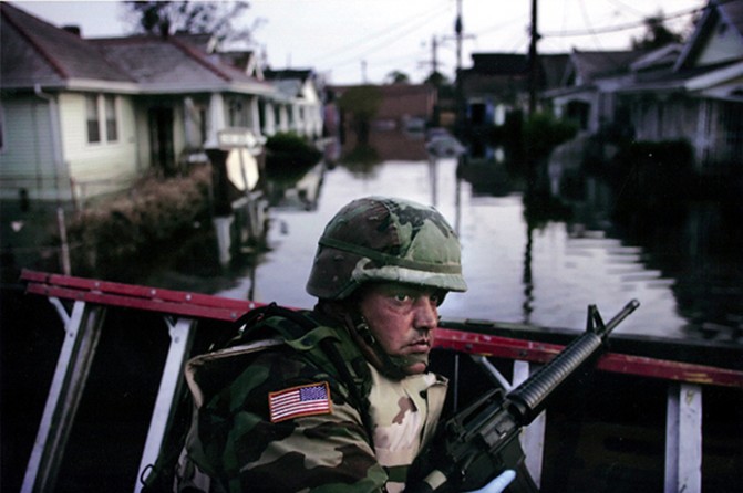 New Orleans, LA -- Texas National Guardsman SPC. Brian Jimenez of Richardson, Texas, was fully armed as he and his North Texas platoon searched for survivors in an area west of downtown.