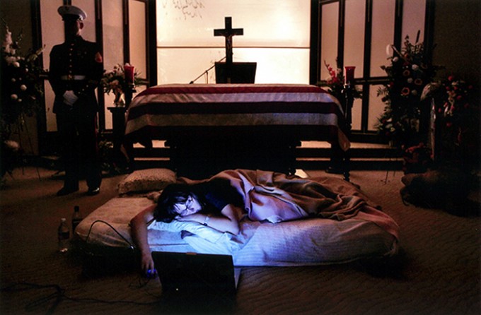 The night before the burial of her husband's body, Katherine Cathey refused to leave the casket, asking to sleep next to his body for the last time. The Marines made a bed for her, tucking in the sheets below the flag. Before she fell asleep, she opened her laptop computer and played songs that reminded her of "Cat," and one of the Marines asked if she wanted them to continue standing watch as she slept. "I think it would be kind of nice if you kept doing it," she said. "I think that's what he would have wa