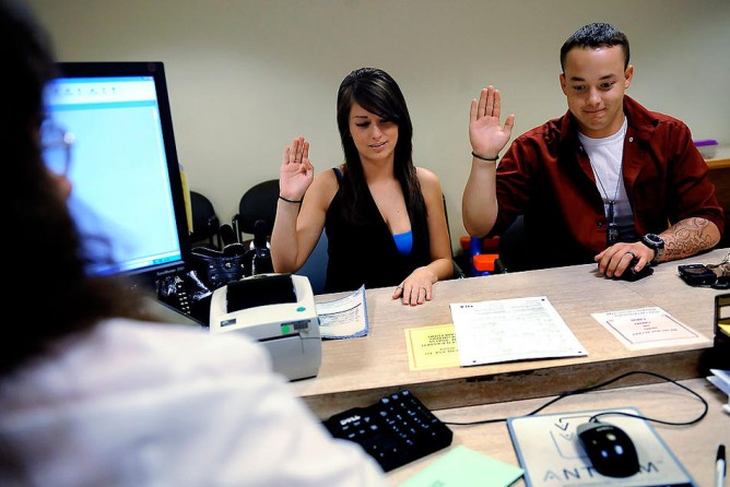 On Aug. 24, 2009, three days after Ian's return from Iraq, he and Devin applied for a marriage license at the Jefferson County, Colo., clerk's office. The couple were married an hour later in a quiet courtroom. They were eager to get married immediately.  Driving away, Ian turned down the music.  "Ya know, everyone gets counseled in Iraq that life is not going to be like your fantasy when you get back home," he said.  "...Well, I'm checking this off my fantasy list." (Craig F. Walker, De