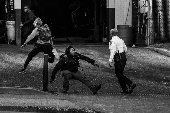 Baltimore Police Commissioner Anthony Batts chases away protestors in a parking lot on Reisterstown Road near Mowdamin Mall in Baltimore, Maryland. The funeral service for Freddie Gray, who died last week while in Baltimore Police custody, was held on Monday morning (Drew Angerer, Getty Images - April 27, 2015).