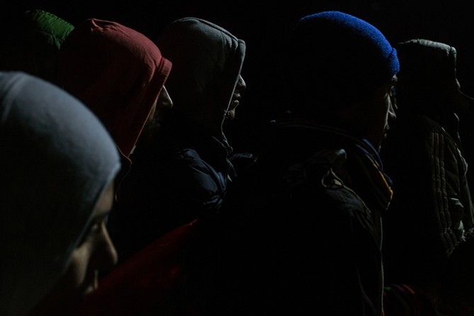 Refugees line up to be registered in a reception camp, in Gevgelija, Macedonia, so they can take a train to Belgrade, Serbia, and continue their journey through the Balkans toward Europe (Mauricio Lima, The New York Times - November 21, 2015).