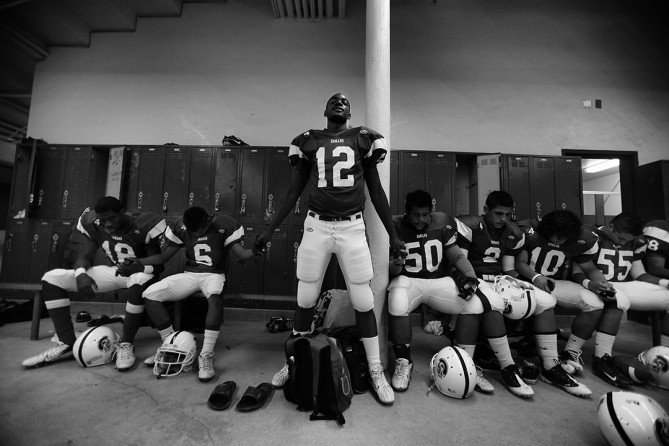 Je'Don Lasley, a junior receiver at Los Angeles High, chokes up as he delivers a pre-game prayer in the Romans' locker room in the teams first home game since Jas, Jamiel Shaw Jr., was killed. Jas used to lead the prayers. 'I say whatever comes and hope we're all right' Lasley said. (Barbara Davidson, Los Angeles Times- December 29, 2010)
