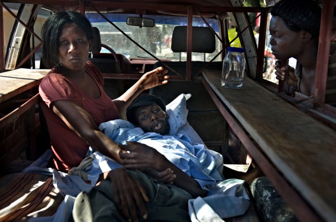 'Cholera' Sylvia Frederic tries in vain to rush her son Johnny Frederic, 26, to the hospital before he dies in her arms. Still reeling from the earthquake, Haiti's misery was deepened by a cholera epidemic that claimed many lives. Cholera can cause vomiting and diarrhea so severe that it can kill from dehydration in hours. The disease had not been seen in Haiti for decades, and many people didn't know about it. (Nikki Kahn, The Washington Post - November 25, 2010)