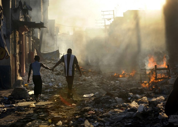 'Life Amid the Ruins' A couple holds hands and walks amid the wreckage of their country's wounded landscape. Experts familiar with the rebuilding efforts in Haiti say relief work is finally speeding up under the guidance of the Interim Haiti Recovery Commission. The group has set a goal of removing 40 percent of the earthquake rubble by October and has approved projects such as highways, apartment buildings and 250 temporary schools for children. But even with these projects underway, rebuilding Haiti will
