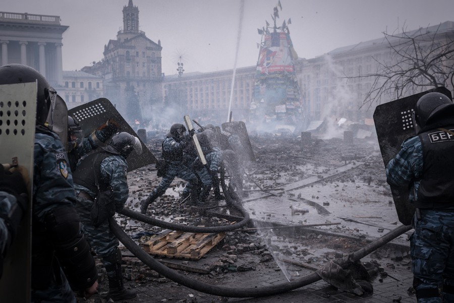 Feb. 19, 2014. Riot police set up a water cannon to aim at the Independence Square protesters. (Sergey Ponomarev for The New York Times)