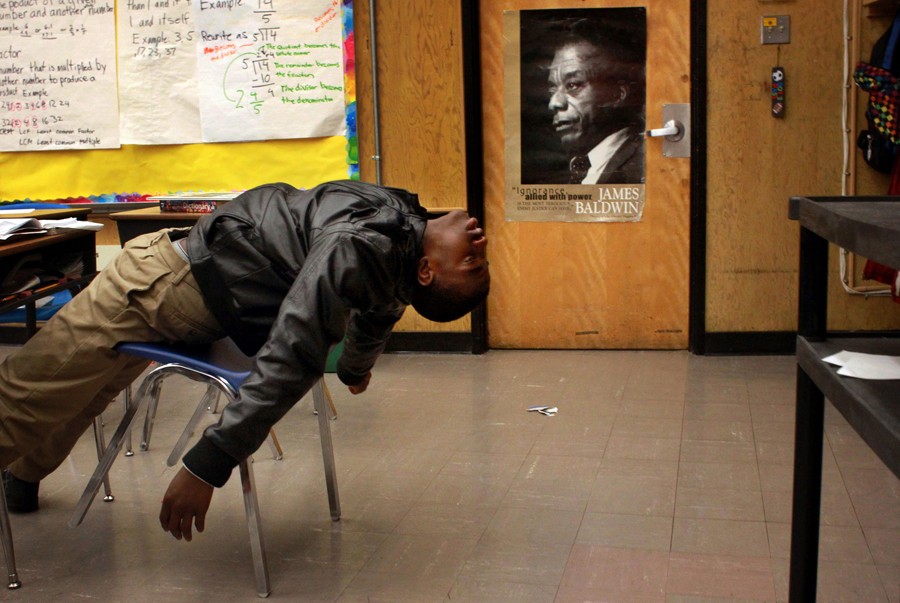 Sixth-grade student Jayden Brumfield acts exasperated as teacher Peter Wilson assigns homework. The children that were chosen to attend the 100 Black Men Charter School were students who acted out or had learning disabilities that the other schools in the district did not want. (August 25, 2013)