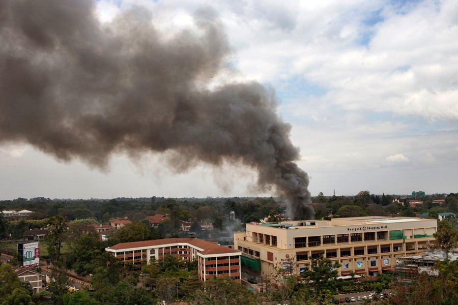A fire broke out at the mall as the siege went on for several days. Police cordoned off the mall, frustrating Hicks in his attempt to learn the fates of the hostages inside. (Tyler Hicks, The New York Times - September 23, 2013)