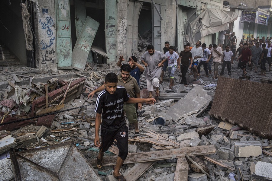 July 18, 2014. The aftermath of an Israeli bomb that exploded in Gaza City. (Tyler Hicks/The New York Times)