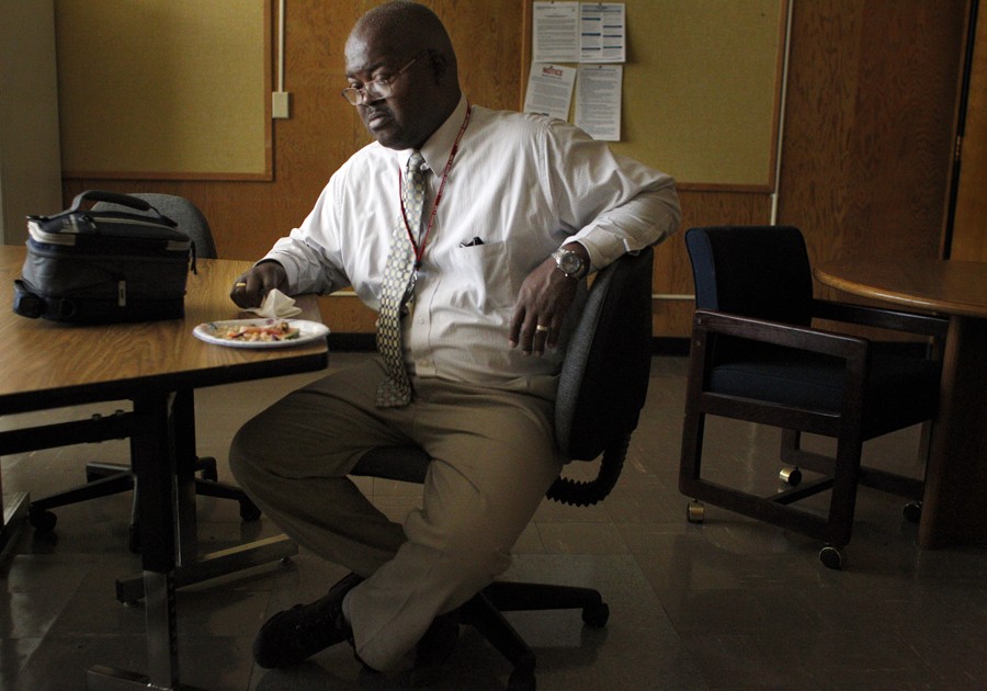 Sixth-grade teacher Peter Wilson finds a moment of respite during lunch alone in the teacher's lounge. Wilson cares deeply for his students, and made it a personal tenant never to yell at the young men, but he was thankful for the rest his 15-minute lunch break provided. (August 25, 2013)