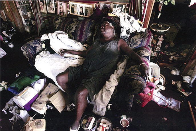 Biloxi, MS -- Eddie Mae Smith, 75, collapsed in her home, which was flooded by Hurricane Katrina and infested with mold and mildew. Bishop Nelson came to check on Ms. Smith and found her in dire condition. Nelson said he needed trailers for people such as Ms. Smith, who can't wait for FEMA aid. 