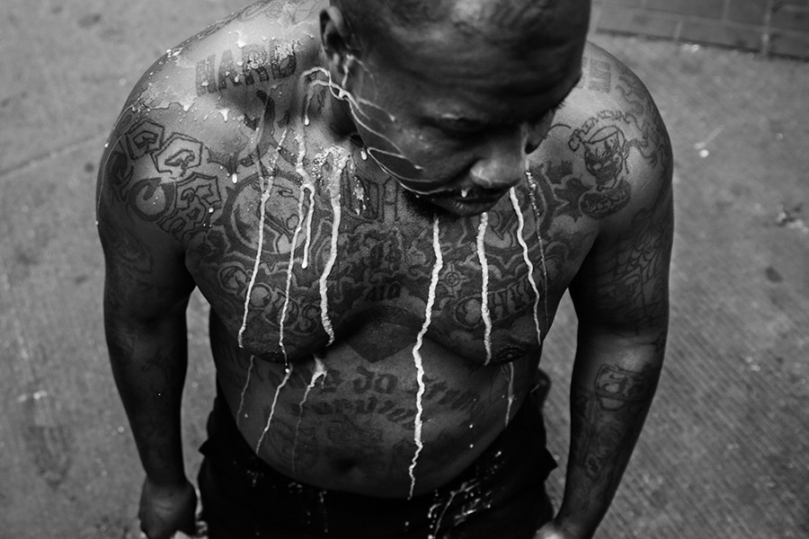 A mixture of milk and water rolls down a man's chest after he was pepper sprayed by the Baltimore Police during violent protests following the funeral of Freddie Gray in Baltimore, Maryland. Gray, 25, who was arrested for possessing a switch blade knife April 12 outside the Gilmor Homes housing project on Baltimore's west side. According to his attorney, Gray died a week later in the hospital from a severe spinal cord injury he received while in police custody (Chip Somodevilla, Getty Images - April 27, 201