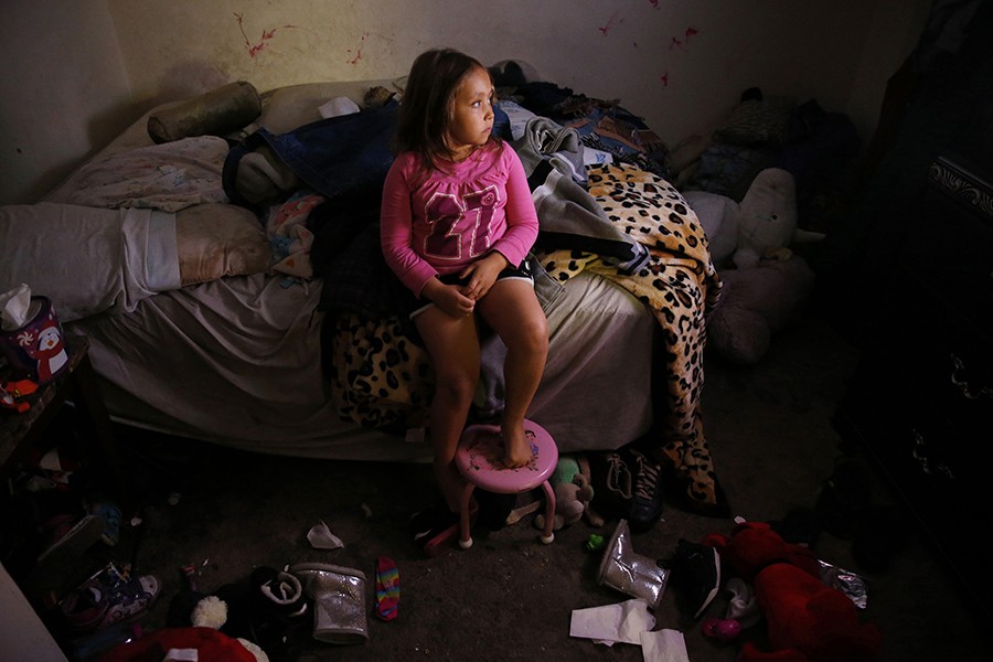 Mimi escaped into her parents' room to watch television the night before her mother started treatment at a methadone clinic. The older of the two children, Mimi is silly but also sensitive and responsible, often helping Raquel with small things like pulling up the socks she can't reach, or swooping in with a hug when she can sense that her mom's mood is about to take a turn (Jessica Rinaldi, The Boston Globe).