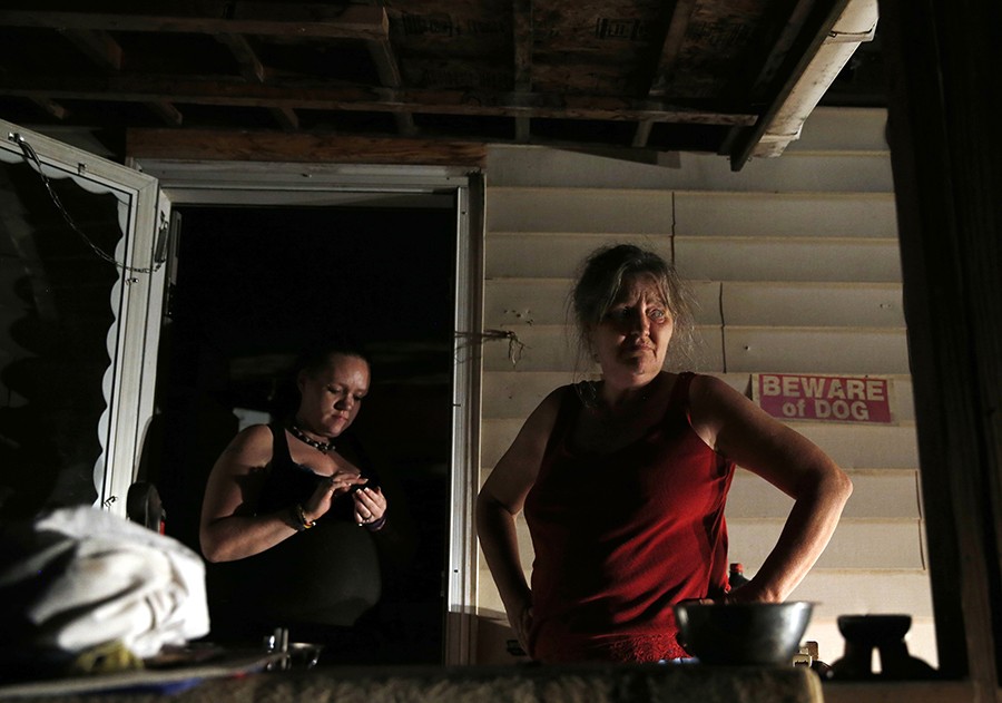 On the night of the eviction, Lanette and her son's fiancée Ashly take a break from packing up the family's belongings. As the night goes on it becomes clear that they are not going to be able to take all of their possessions with them (Jessica Rinaldi, The Boston Globe).