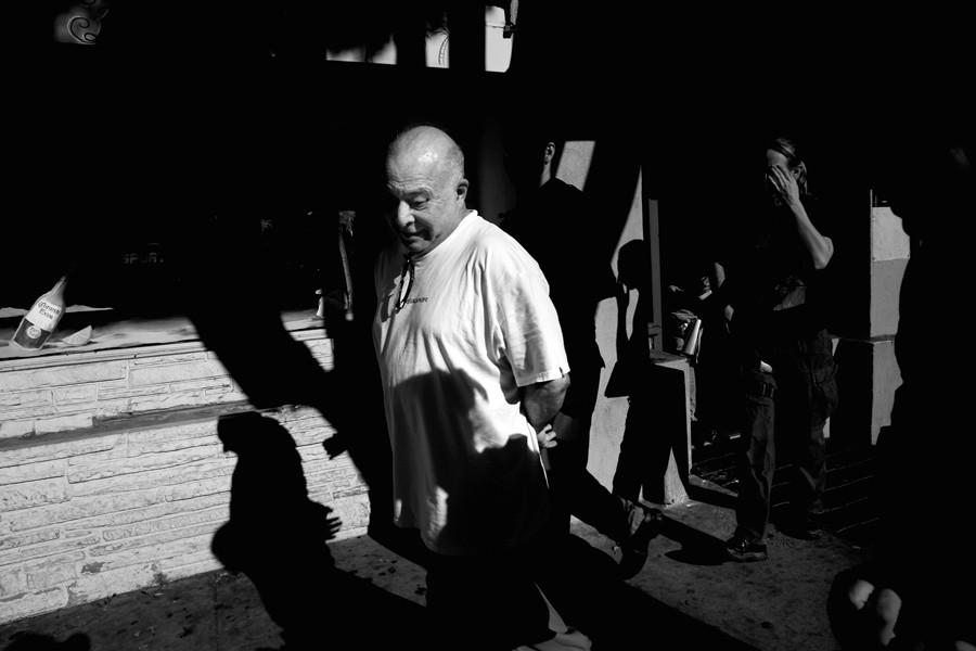 Dr. Julio Diaz is led from his Santa Barbara office after being arrested on federal drug trafficking charges; soon after, his medical license would be revoked. (December 9, 2012)