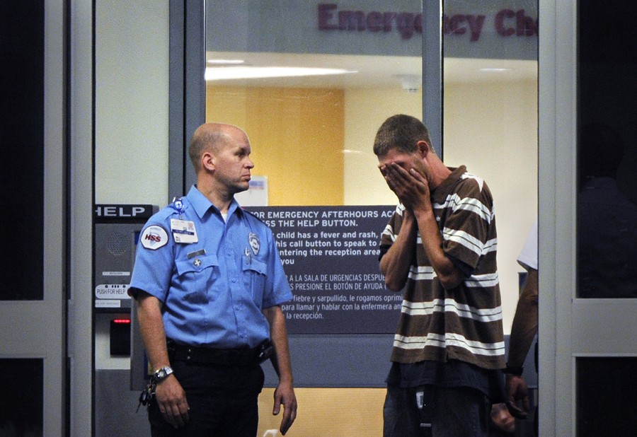 Ian Sullivan is overcome with emotion as he arrives at Children's Hospital in Aurora, Colo. frantically searching for his daughter and his ex-wife. (Craig F. Walker - July 21, 2012)