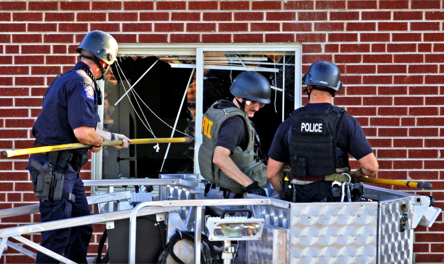 Police investigate James Holmes' apartment near the intersection of 17th Street and Paris Street on Friday, July 20, 2012. (Stephen Mitchell - July 21, 2012)