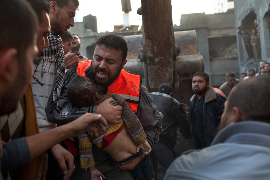 The body of a boy found after an apartment building in central Gaza City was hit by Israeli bombs. (November 18, 2012)