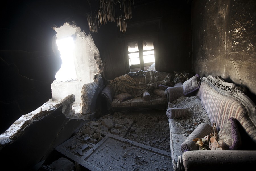 An apartment destroyed by tank shelling is seen in a building in the Karm al-Jabel neighborhood after several days of intense clashes between rebel fighters and the Syrian army in Aleppo, Syria, Oct. 28, 2012. (Narciso Contreras, Associated Press - October 28, 2012)