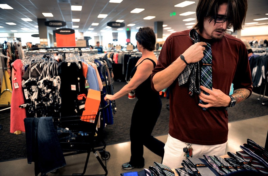 Scott looks through ties at Nordstrom Rack in Boulder, as he gets ready for his first day of work. 'It's just the Cheesecake Factory, but I hope I don't blow up on a customer. I'm worried about what people will think about me. ... I don't want them to point me out and say, 'This guy doesn't belong here.' ... I don't know if my anxiety is normal or not. It's a new job, so it's probably normal. I'm a hard worker. I have a good work ethic. I can multitask. I can lead. I just hope my personal life doesn't inter