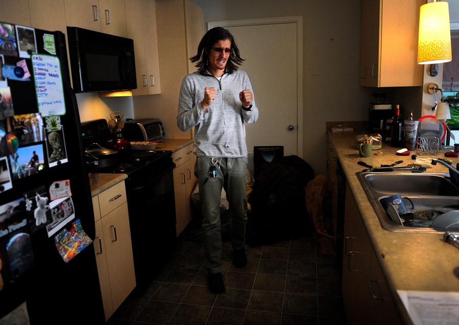 Scott stands tensely in the kitchen, where his day starts with a panic attack. He said the day before was 'one long panic attack' and that this day was starting out similarly. Scott said his PTSD was becoming unmanageable. 'I don't know what I want. I need someone to tell me what to do,' he said. He explained his panic attacks as tingling hands and feet - that his arms and legs felt detached. 'I'm short of breath and my chest is tight, painfully tight.'  (Craig F. Walker, The Denver Post - December 29, 2011